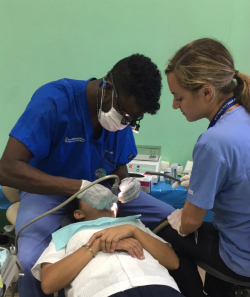 School of Dentistry student Biniat Kabir '17 operates on Honduran patient