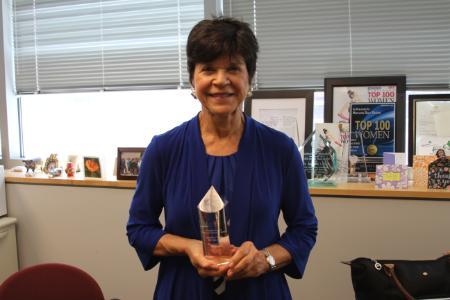 Photograph of Jackie Fried with Irene Newman award