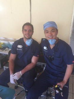 Eduardo Cruz, DDS, third-year endodontics resident at Harvard School of Dental Medicine, and Juheon Seung, DDS, endodontics resident at UMSOD, performed root canals at the Helping Hands Clinic.