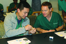 Dan Yang and Ben Horn learn to check blood glucose levels