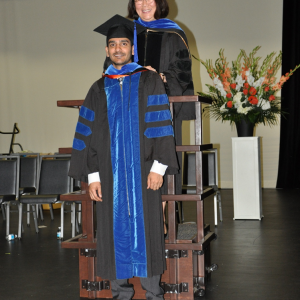Dr. Lowe at student hooding ceremony