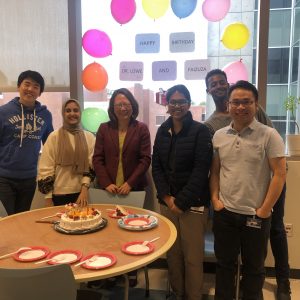 Dr. Lowe and students at a birthday party