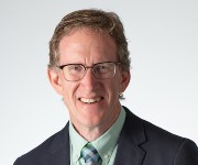 Professional headshot of James Cope