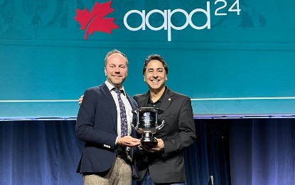 Vineet Dhar, BDS, PhD, assistant dean of Postgraduate and Professional Studies in Dentistry, clinical professor and chair of the Department of Orthodontics and Pediatric Dentistry, holding the Suzi Seale Evidence-Based Dentistry Service Award next to co-recipient Cameron L Randall, PhD, University of Washington School of Dentistry, who served as a member of the workgroup that Dhar chaired.