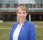 Dr. Noonan standing outside in front of a building