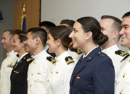 Graduating students take their oath of service