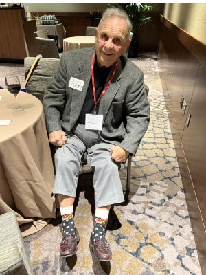 Albert Pizzi, DDS ’62, shows off a pair of socks