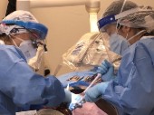 Two dental hygiene students in clinic