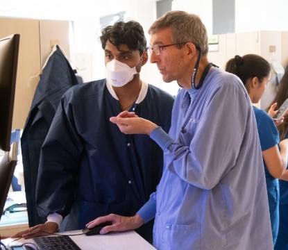 UMSOD’s Ramsay Koury, who oversaw the Mission of Mercy event, discusses patient care with fourth-year dental student Shravan Thiagarajan.