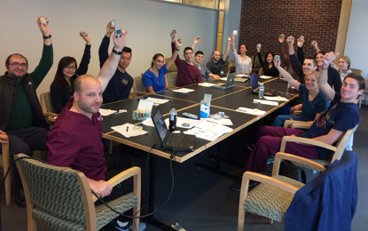 A group of UMSOD students hold up glucose meters.