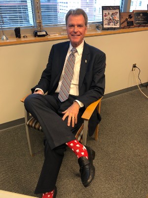 Dean Mark Reynolds wearing a pair of colorful socks