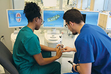 Ben Horn, LaShonda Shepard, and Dan Yang learn about CAD/CAM technology