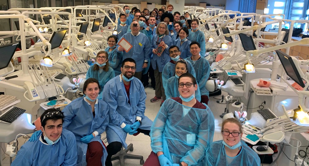 Students and faculty of Operative Dentistry pose in UMSOD's Simulation Lab