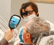 A dentist providing care for a patient