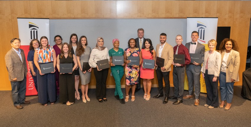 Dean Reynolds poses with a group of students for the 2023 Leadership Ceremony