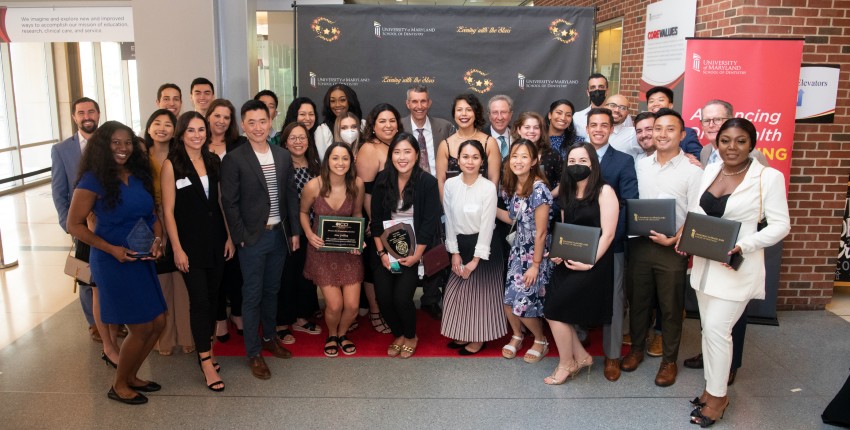 A group of students, faculty and community members pose together at Evening with the Stars